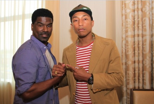 This photo of Glenn Lewis (L) and Pharrell Williams was taken at the 2013 BET Experience.  Pharrell is up for 2  2014 BET Awards.