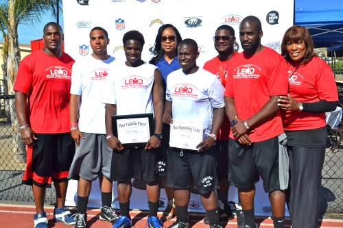 Far right Susan English and Far Left Larry English are pictured with student athletes and parent at the 2014 Larry English Camp held at Mount Miguel High School in Spring Valley, CA