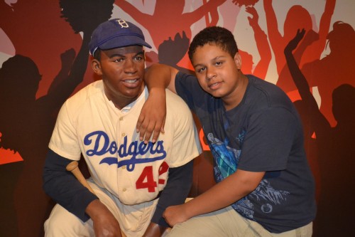 A,J. poses with Jackie Robinson at Madam Tussauds.