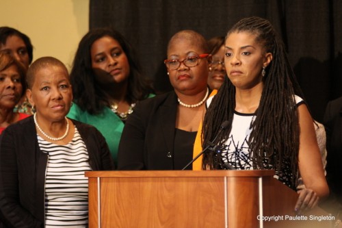 Members of the Black Women's Roundtable look on as Dr. Avis Jones-DeWeever (at podium) shares her experience with domestic abuse during the BWR press conference urging NFL commissioner Roger Goodell to add Black women to his advisory team. The press conference was held during the CBCF Annual Legislative Conference in DC. PHOTO CREDIT: Paulette Singleton.