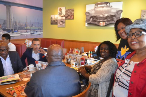 Pictured:  JoAnn Fields (center), Carol Jeffries (L) Rhonda Phillips (R). Across, Pastor Shane Harris (R), left Dr. Willie Blair.