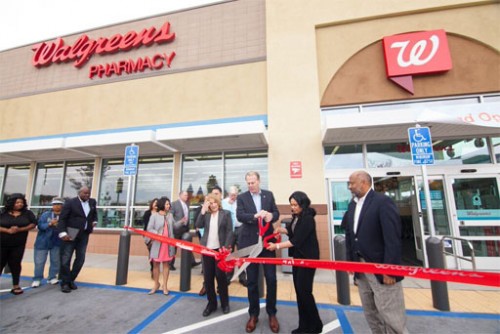  Left to right - Officials from Walgreens join Jacobs Center Board Member Valerie Jacobs Hapke, City of San Diego Mayor Kevin Faulconer, District 4 Councilmember Myrtle Cole, and Jacobs Center President and CEO Reginald Jones to officially cut-the ribbon to open the Walgreens near the corner of Market Street and Euclid Avenue.