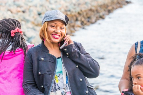 Lekesha of Dallas (Kimora's Mom) poses while on a call at Seaport Village.