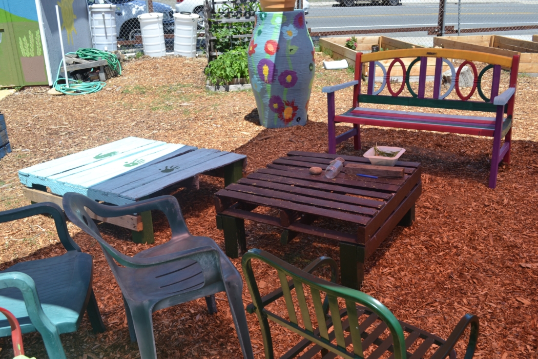 Colorful outdoor furniture adds a warm touch to Mt. Hope Community Garden. 