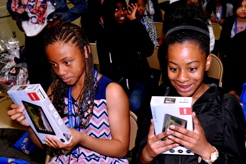 The reaction of the girl's face was priceless after learning that they would receive a tablet.