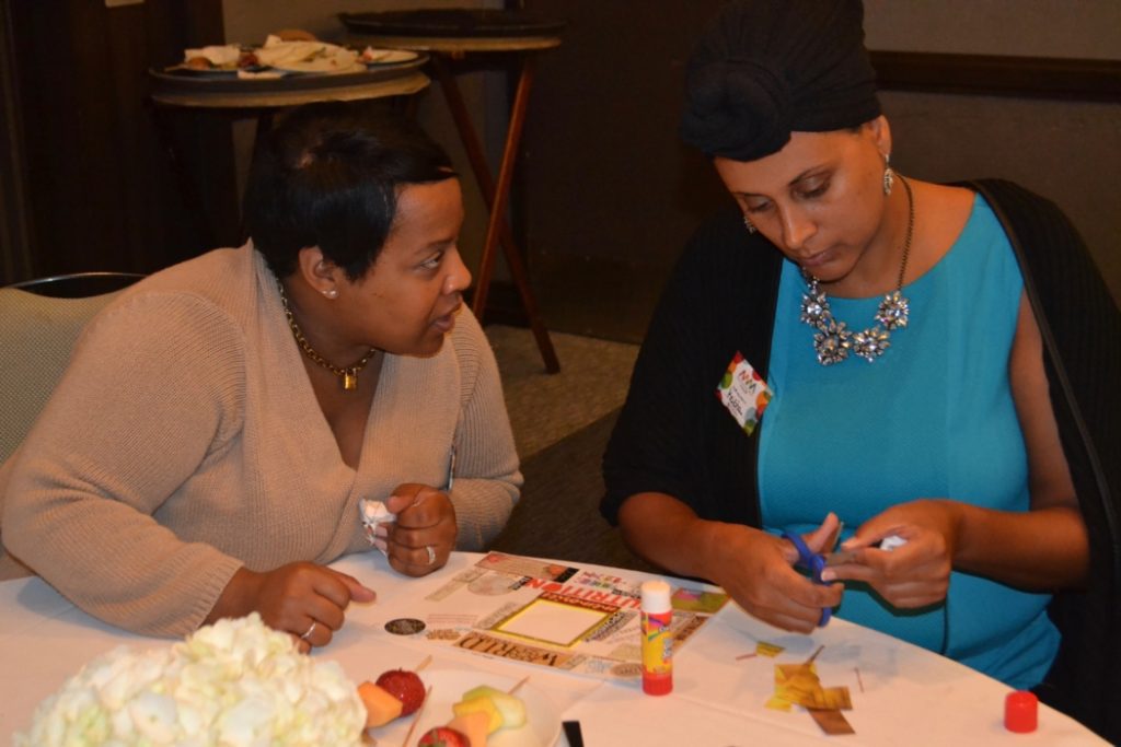 Participants at the Motivated Mom's tour creating vision boards.